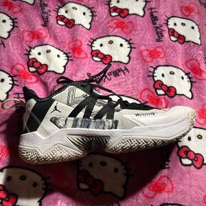 black and white Nike jordan running shoes.